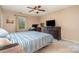 Comfortable bedroom featuring a TV, desk, and window, creating a relaxing and functional space at 920 Manor Dr, Kings Mountain, NC 28086