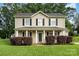 Charming two-story home with a welcoming front porch and manicured lawn at 920 Manor Dr, Kings Mountain, NC 28086