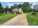 Inviting home exterior featuring a spacious front yard and long driveway at 920 Manor Dr, Kings Mountain, NC 28086