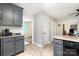 Cozy kitchen featuring gray cabinets and neutral countertops, complemented by easy access to other rooms at 920 Manor Dr, Kings Mountain, NC 28086