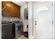 Laundry room with a washer, dryer, cabinets, and door to the exterior at 920 Manor Dr, Kings Mountain, NC 28086