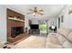 Relaxing living room with fireplace, TV, and sliding glass door, making it ideal for modern living and relaxation at 920 Manor Dr, Kings Mountain, NC 28086