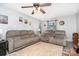 Relaxing living room featuring neutral walls, ceiling fan, and carpet, creating a warm and welcoming atmosphere at 920 Manor Dr, Kings Mountain, NC 28086