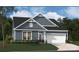 Charming single-Gathering home with a well-manicured lawn, gray siding and an attached two-car garage at 939 Exeter Dr, Sherrills Ford, NC 28673