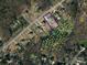 An aerial view displays property lines of a home that is adjacent to land with dense tree cover at 9450 Surface Hill Rd, Mint Hill, NC 28227
