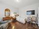 This bedroom is brightly lit, featuring wooden floors, simple furnishings, and a peaceful atmosphere for relaxation at 9450 Surface Hill Rd, Mint Hill, NC 28227