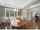 Inviting dining room with hardwood floors, natural light, and stylish decor, ideal for entertaining guests at 9450 Surface Hill Rd, Mint Hill, NC 28227