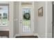 Bright entryway featuring a decorative glass front door and elegant hardwood floors, creating a welcoming ambiance at 9450 Surface Hill Rd, Mint Hill, NC 28227