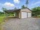 Spacious detached garage with two bays and gravel driveway, offering ample parking and storage space at 9450 Surface Hill Rd, Mint Hill, NC 28227