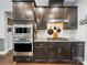 This kitchen features dark wood cabinets, stainless steel appliances, and a granite countertop, for modern cooking at 9450 Surface Hill Rd, Mint Hill, NC 28227