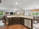 Open kitchen featuring dark cabinets, granite countertops and stainless steel dishwasher at 9450 Surface Hill Rd, Mint Hill, NC 28227