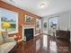 Bright living room with fireplace, hardwood floors and lots of natural light at 9450 Surface Hill Rd, Mint Hill, NC 28227