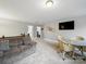 Upstairs living area features plush carpeting, comfortable seating, and a table with seating, perfect for gatherings at 9450 Surface Hill Rd, Mint Hill, NC 28227