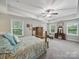 Spacious main bedroom with tray ceilings, ample natural light, and a calming color palette, for a relaxing retreat at 9450 Surface Hill Rd, Mint Hill, NC 28227