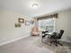Bright office area with a desk, comfortable chairs, and a large window with natural light at 9450 Surface Hill Rd, Mint Hill, NC 28227