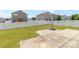 Spacious backyard with a white picket fence, green lawn, and a concrete patio at 1007 Green Terra Rd, Indian Trail, NC 28079