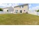 Expansive backyard featuring a white picket fence and patio, perfect for outdoor entertaining and relaxation at 1007 Green Terra Rd, Indian Trail, NC 28079