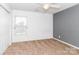 Bright bedroom featuring neutral carpet, a ceiling fan, and a window with bright natural light at 1007 Green Terra Rd, Indian Trail, NC 28079
