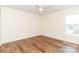 Bedroom featuring laminate flooring, a ceiling fan, and a window overlooking the yard at 1007 Green Terra Rd, Indian Trail, NC 28079