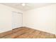 Bedroom featuring laminate flooring, a ceiling fan, and a closet for storage at 1007 Green Terra Rd, Indian Trail, NC 28079