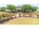 Charming clubhouse with stone accents, covered porch, and beautifully landscaped grounds at 1007 Green Terra Rd, Indian Trail, NC 28079