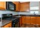 Modern kitchen featuring stainless steel appliances, granite countertops and a gas range at 1007 Green Terra Rd, Indian Trail, NC 28079