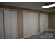Neutral-toned basement featuring three closets and gray concrete floors at 1038 Holmes Ave, Salisbury, NC 28144