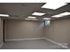 Clean, well-lit basement area, perfect for storage or finishing into a functional living space at 1038 Holmes Ave, Salisbury, NC 28144
