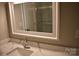 Bathroom vanity featuring a mirror and stylish marble countertop at 1038 Holmes Ave, Salisbury, NC 28144
