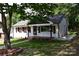 Charming one-story home with well-kept lawn, sidewalk, and front porch at 1038 Holmes Ave, Salisbury, NC 28144