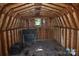 Interior of shed showcasing wooden walls, window, and wooden floors at 1038 Holmes Ave, Salisbury, NC 28144