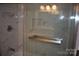 Modern tiled shower with glass door and built-in niche at 1038 Holmes Ave, Salisbury, NC 28144