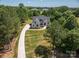 Aerial view of home nestled among mature trees with long driveway at 1062 Sage Pine Cir, Clover, SC 29710