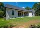 The backyard of the home features a covered patio and well manicured lawn at 1062 Sage Pine Cir, Clover, SC 29710