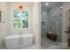 Bright bathroom with freestanding tub and marble shower at 1062 Sage Pine Cir, Clover, SC 29710