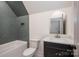 Well-lit bathroom featuring a modern vanity and tub with gray accent tiling at 1062 Sage Pine Cir, Clover, SC 29710