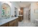 Spacious bathroom with double vanity, marble floors, and modern fixtures at 1062 Sage Pine Cir, Clover, SC 29710