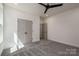 Neutral bedroom featuring soft carpeting, double-door closet, and a ceiling fan at 1062 Sage Pine Cir, Clover, SC 29710