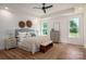 Serene bedroom with tray ceiling, natural light, and hardwood flooring at 1062 Sage Pine Cir, Clover, SC 29710