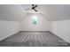 Spacious bonus room with vaulted ceiling, modern ceiling fan, and a window at 1062 Sage Pine Cir, Clover, SC 29710