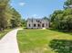 Attractive white brick home with well-maintained lawn and an inviting driveway at 1062 Sage Pine Cir, Clover, SC 29710