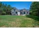 Stylish white brick home featuring a well-manicured lawn and a classic architectural design at 1062 Sage Pine Cir, Clover, SC 29710