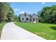 Stunning home featuring a well-manicured lawn and inviting front entrance at 1062 Sage Pine Cir, Clover, SC 29710