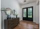 Elegant foyer with beautiful flooring, stylish decor, and glass paneled front doors at 1062 Sage Pine Cir, Clover, SC 29710