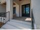 Detailed view of the home's front entrance, showcasing a black door at 1062 Sage Pine Cir, Clover, SC 29710
