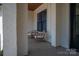 Cozy front porch featuring wicker chairs, brick columns, and a wood-paneled ceiling at 1062 Sage Pine Cir, Clover, SC 29710