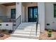 Inviting front porch with white brick, black railings, and stylish double doors at 1062 Sage Pine Cir, Clover, SC 29710