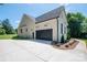 Stunning home features a three-car garage, a concrete driveway, and lovely landscaping at 1062 Sage Pine Cir, Clover, SC 29710