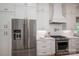 Gourmet kitchen with stainless steel appliances, white cabinetry, subway tile backsplash, and a gas range at 1062 Sage Pine Cir, Clover, SC 29710