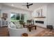 Spacious living room featuring a fireplace, natural light, and stylish furnishings at 1062 Sage Pine Cir, Clover, SC 29710